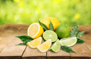 Limes and lemons on table