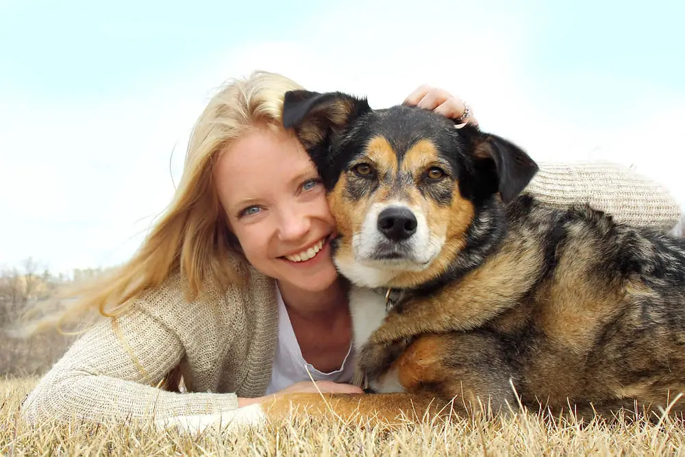 Dog protecting woman