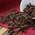 Cloves on table and bowl